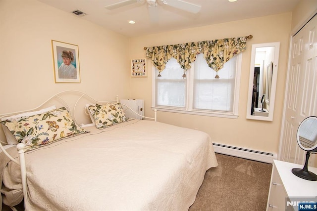 bedroom featuring carpet, visible vents, ceiling fan, a closet, and baseboard heating