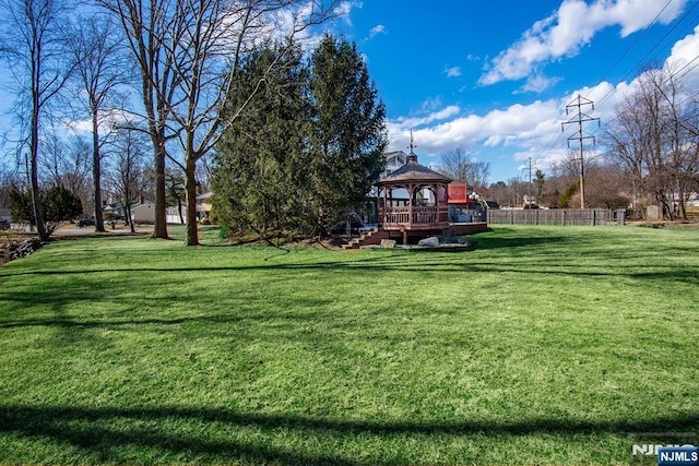 view of yard featuring a gazebo and fence