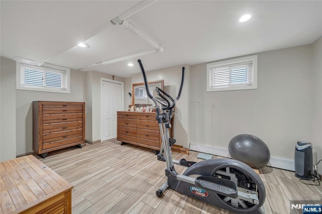 exercise area featuring light wood-style floors, plenty of natural light, and recessed lighting