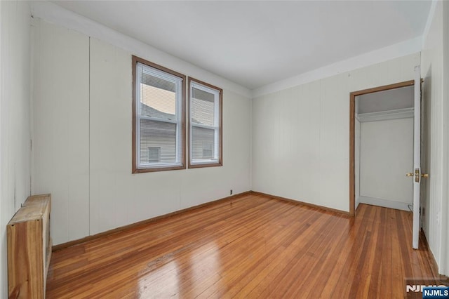 unfurnished bedroom featuring light wood-style floors