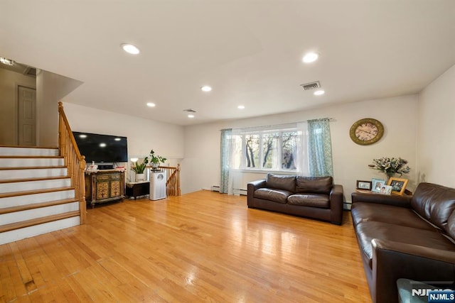 living area with stairs, light wood-type flooring, visible vents, and recessed lighting