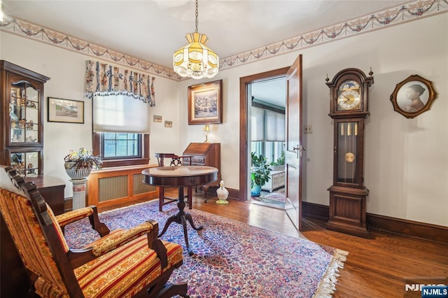 office featuring baseboards and wood finished floors