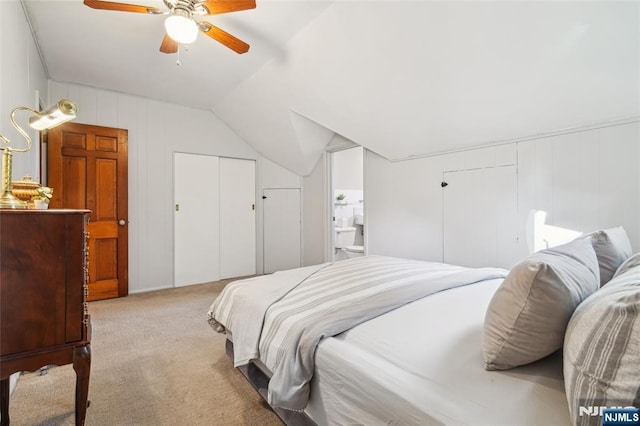 bedroom with lofted ceiling, carpet, and a ceiling fan