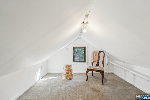 unfurnished room with baseboards, carpet floors, and vaulted ceiling