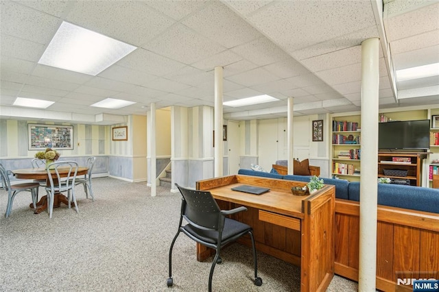 home office featuring a drop ceiling and carpet