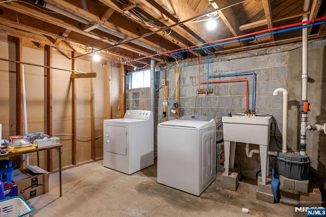 clothes washing area with laundry area and washing machine and clothes dryer