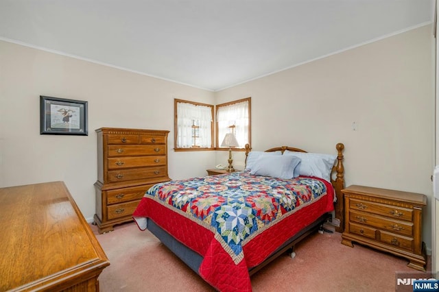 bedroom with light carpet and crown molding