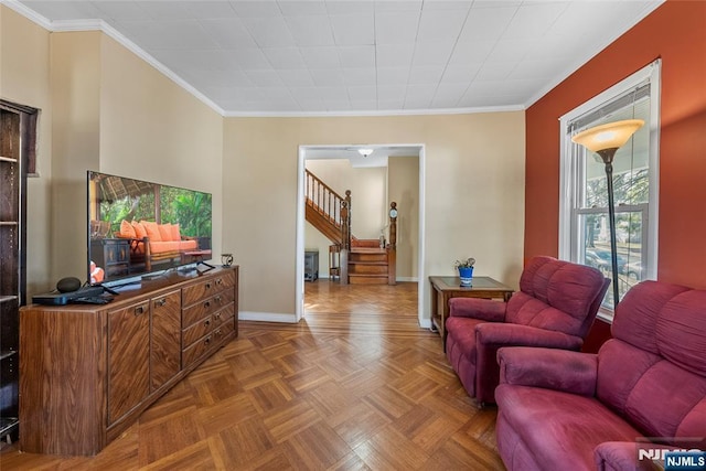 living room featuring baseboards, stairs, and ornamental molding