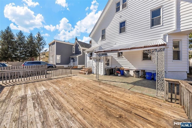 wooden deck featuring a residential view