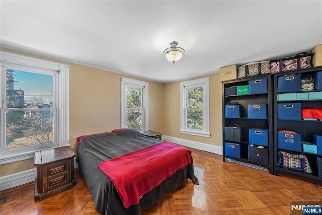 bedroom featuring baseboards