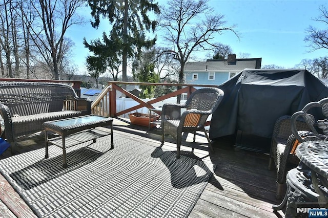 wooden deck featuring grilling area