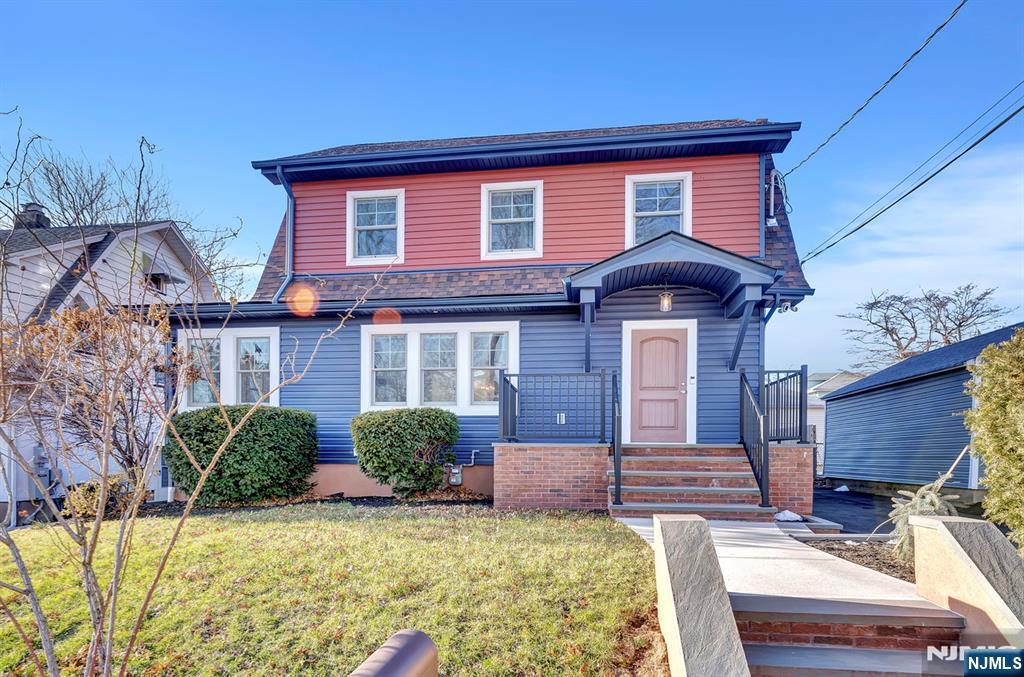 traditional-style home with a front yard