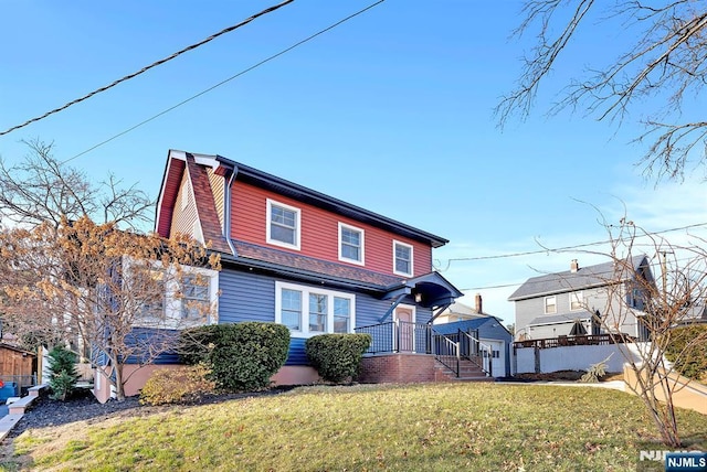 view of front of house with a garage and a front yard