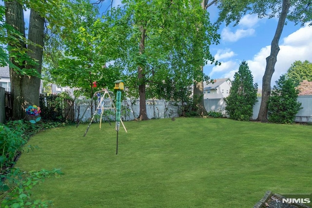 view of yard featuring a fenced backyard