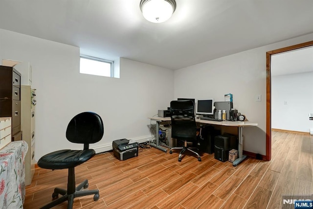 office featuring baseboards and wood tiled floor