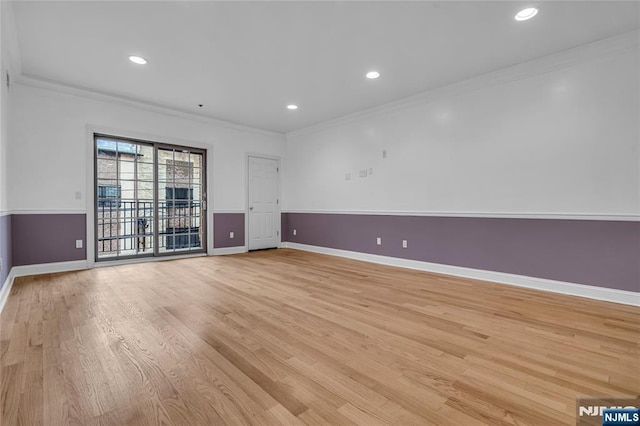 spare room featuring ornamental molding, light wood-type flooring, recessed lighting, and baseboards