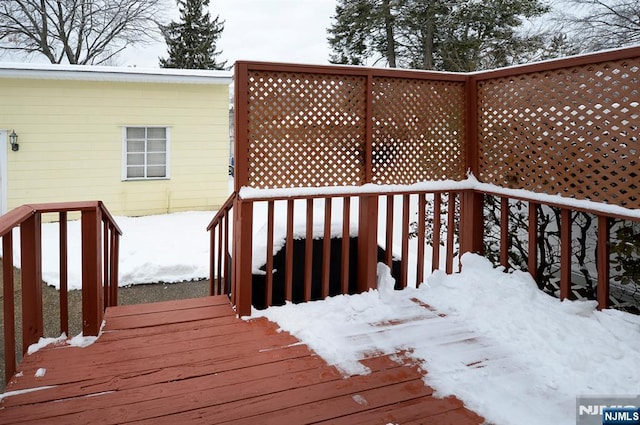 view of snow covered deck