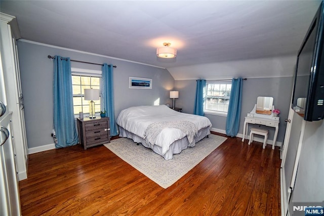 bedroom featuring dark wood-style flooring, multiple windows, vaulted ceiling, and baseboards