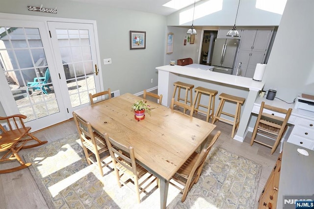 dining room with baseboards and wood finished floors