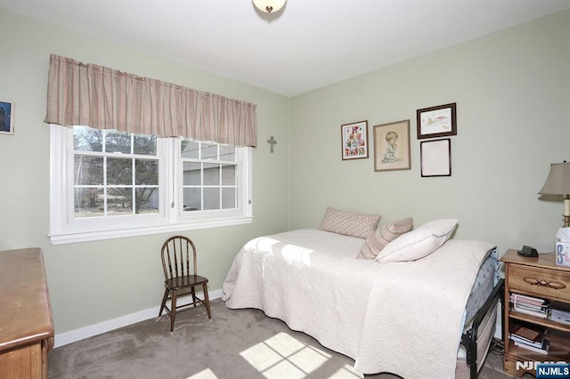 carpeted bedroom with baseboards