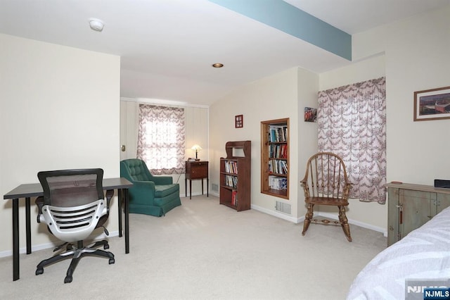 bedroom with carpet floors, baseboards, visible vents, and vaulted ceiling