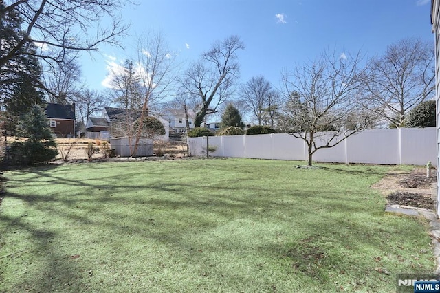 view of yard with fence