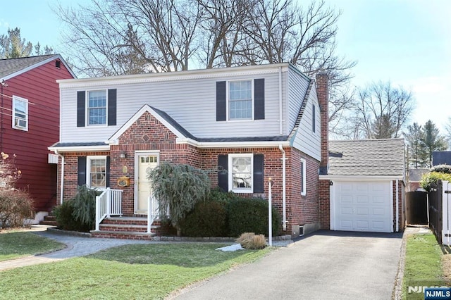 view of front facade featuring aphalt driveway, brick siding, a chimney, and an attached garage