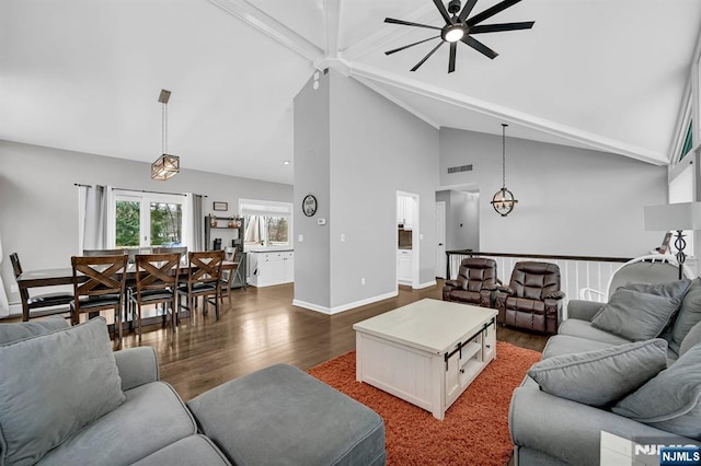 living room featuring visible vents, baseboards, dark wood-style floors, ceiling fan, and high vaulted ceiling