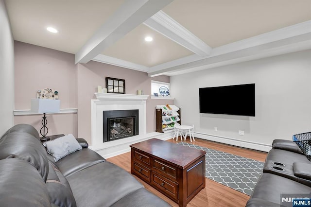 living area with light wood-style flooring, beam ceiling, and recessed lighting