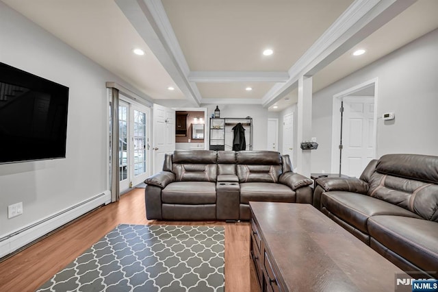 living room with a baseboard heating unit, recessed lighting, light wood-style floors, and beamed ceiling