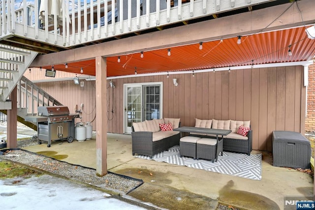 view of patio / terrace featuring outdoor lounge area, stairway, and area for grilling