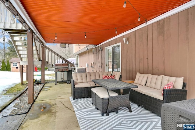 view of patio / terrace featuring grilling area, stairs, and an outdoor hangout area