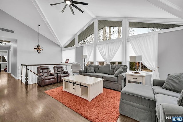 living area with high vaulted ceiling, a ceiling fan, visible vents, and wood finished floors