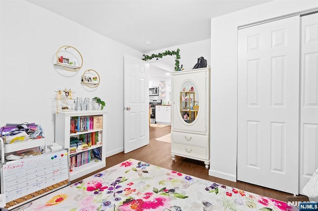 bedroom featuring a closet and wood finished floors