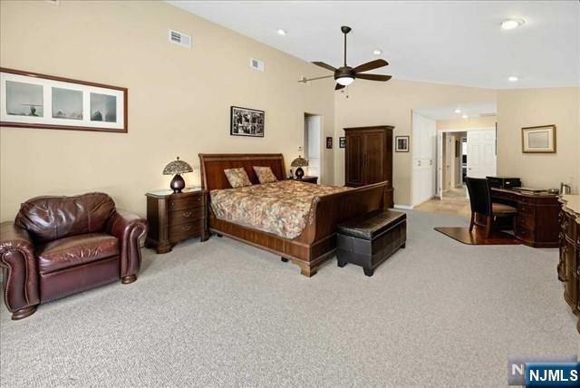 bedroom featuring lofted ceiling, carpet, visible vents, and recessed lighting