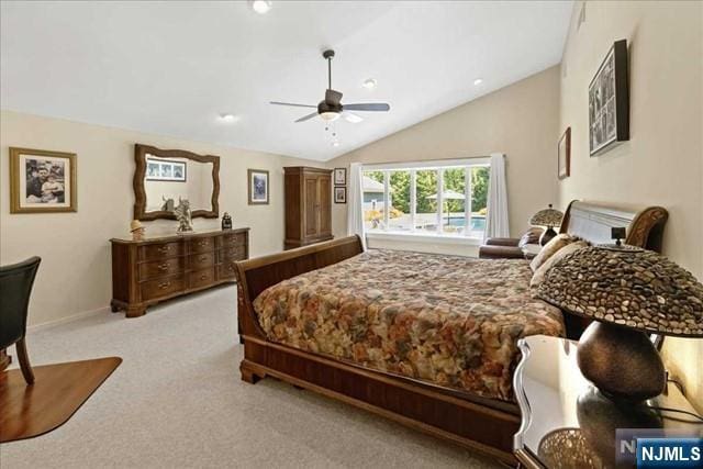 bedroom featuring carpet flooring, vaulted ceiling, baseboards, and ceiling fan