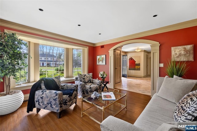 85 Buckhaven Hl, Upper Saddle River, NJ 07458 - living room with ornate columns, arched walkways, ornamental molding, wood finished floors, and baseboards