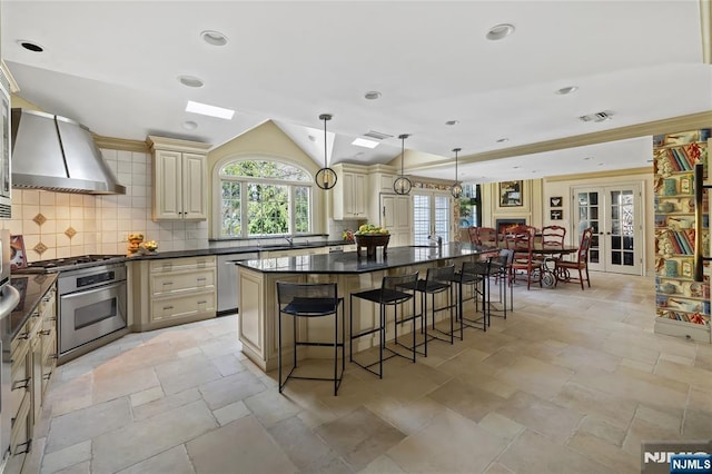 85 Buckhaven Hl, Upper Saddle River, NJ 07458 - kitchen with cream cabinets, stainless steel appliances, dark countertops, french doors, and lofted ceiling