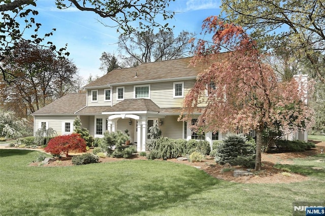 85 Buckhaven Hl, Upper Saddle River, NJ 07458 - view of front facade featuring a front yard and a shingled roof