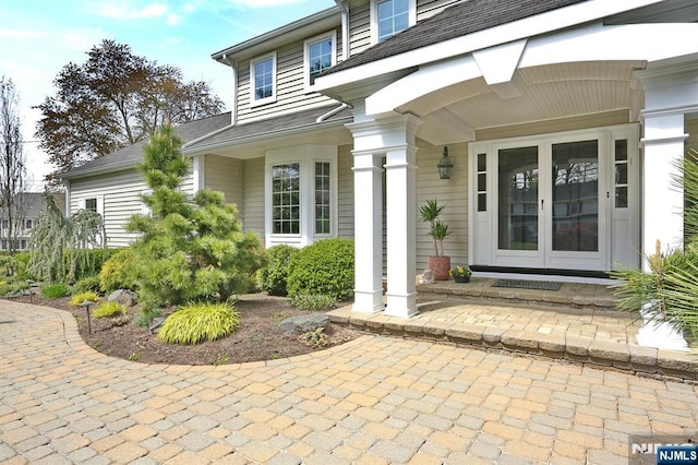 85 Buckhaven Hl, Upper Saddle River, NJ 07458 - view of exterior entry featuring a porch and roof with shingles