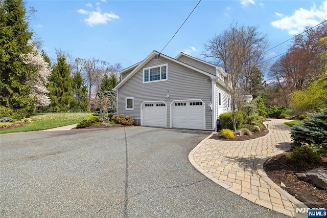 85 Buckhaven Hl, Upper Saddle River, NJ 07458 - view of property exterior with driveway and a garage