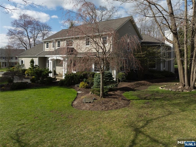 85 Buckhaven Hl, Upper Saddle River, NJ 07458 - rear view of house featuring a lawn and a shingled roof