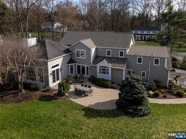 85 Buckhaven Hl, Upper Saddle River, NJ 07458 - back of property featuring a patio, a lawn, and a shingled roof