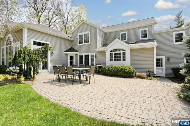 85 Buckhaven Hl, Upper Saddle River, NJ 07458 - rear view of house with a patio