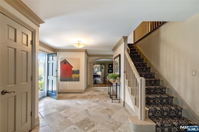 85 Buckhaven Hl, Upper Saddle River, NJ 07458 - entryway featuring stone tile floors, arched walkways, stairway, baseboards, and ornamental molding