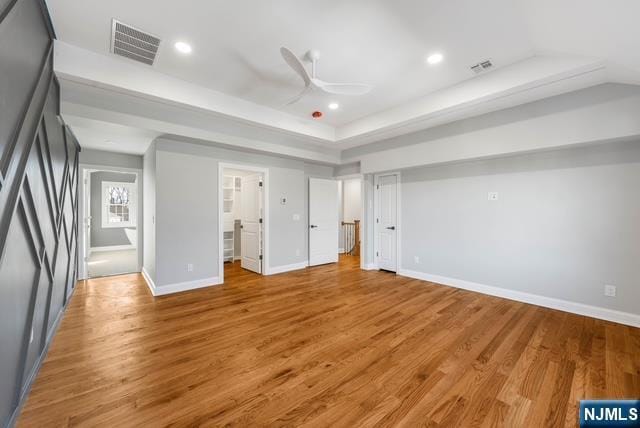 unfurnished bedroom featuring baseboards, light wood-type flooring, visible vents, and recessed lighting