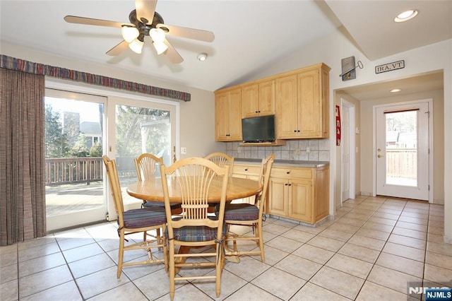 dining room featuring lofted ceiling, recessed lighting, a ceiling fan, and light tile patterned flooring