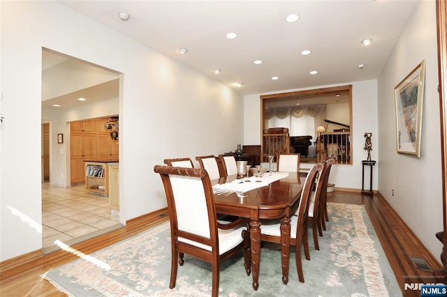 dining room featuring visible vents, light wood-style flooring, and recessed lighting