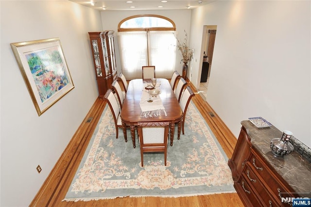 dining space featuring visible vents and light wood-style floors