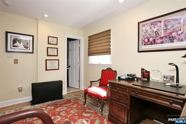 interior space with baseboards and recessed lighting